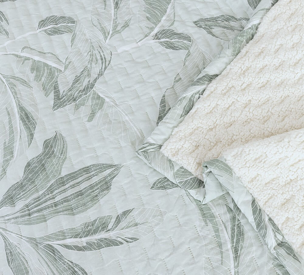 Cubrecama Quilt Estampado Sherpa Banano 1.5 Plazas Turquesa